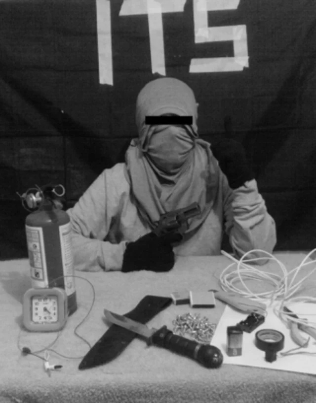 Screenshot of a terrorist presenting improvised weapons 
