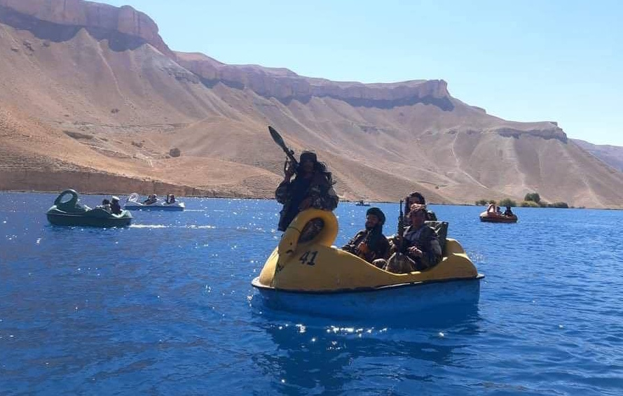 Photo of armed Taliban fighters on paddleboats